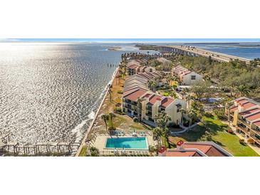 Waterfront condos offer a pool, lush landscaping and stunning views of the bay and bridge at 7520 Sunshine Skyway S Ln # 110, St Petersburg, FL 33711