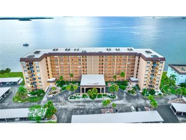 An inviting condo complex with covered parking and lush landscaping offers waterfront views at 9 Haig Pl # 510, Dunedin, FL 34698