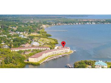 Waterfront condo building with private boat slips and stunning water views at 140 Brent Cir, Oldsmar, FL 34677