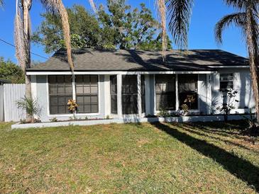 Charming single-story home with a well-maintained lawn and freshly painted exterior at 321 David Ave, Clearwater, FL 33759