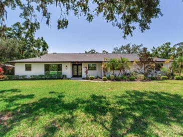 Charming single-story home with a well-manicured lawn and attractive landscaping at 6310 95Th E St, Bradenton, FL 34202