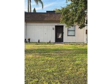 Charming single-story home featuring a well-maintained lawn and a welcoming front door at 2961 Flint N Dr, Clearwater, FL 33759