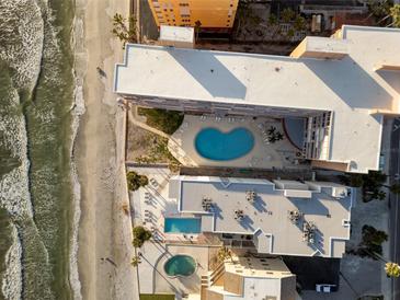 Stunning aerial view of beachfront property with pools and beautiful sandy shoreline at 16400 Gulf Blvd # 505, North Redington Beach, FL 33708