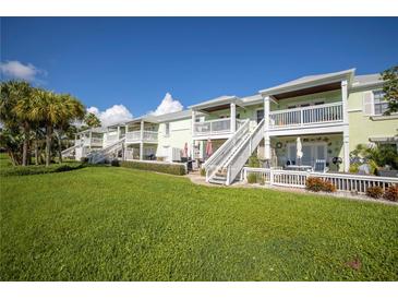 Charming townhomes with private patios, balconies, and lush landscaping offer a serene outdoor living experience at 4816 Snook Se Dr # F, St Petersburg, FL 33705