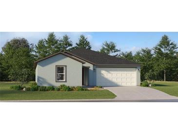 Charming single-story home with a well-manicured lawn, a two-car garage, and attractive landscaping at 5709 Yellow Hornbill Ave, Wimauma, FL 33598
