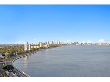 Stunning city skyline view from the waterfront property with blue skies above reflecting off the water at 3301 Bayshore Blvd # 2207B, Tampa, FL 33629