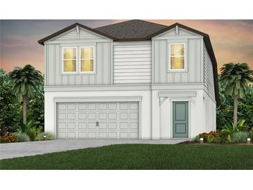 Charming two-story home featuring a two-car garage, neutral color palette, and lush landscaping at 9768 Crescent Moon Dr, Riverview, FL 33578