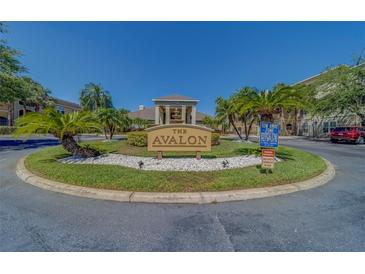 Welcome to Avalon, featuring lush landscaping, palm trees, and a tranquil fountain at 1240 S Missouri Ave # 415, Clearwater, FL 33756