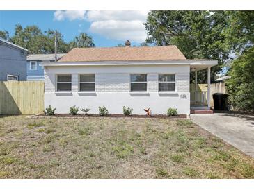 Charming single-story home featuring a brick facade, three windows, and manicured landscaping at 1125 19Th N Ave, St Petersburg, FL 33704