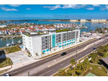 An aerial view of the Residences showcasing its premium bayside location, rooftop deck, and water views at 400 150Th Ave # 506, Madeira Beach, FL 33708