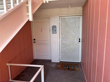 Condo unit entrance featuring a welcoming mat that reads: Peace, love and flip flops at 4225 38Th S Ave # 63C, St Petersburg, FL 33711