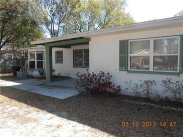 Charming single-story home with covered porch and well-maintained landscaping, providing inviting curb appeal at 5318 7Th N Ave, St Petersburg, FL 33710