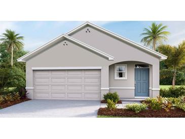 Charming single-Gathering home features a two-car garage, a well-maintained lawn, and a welcoming light-blue front door at 5539 Warrington Town Path, Wesley Chapel, FL 33545
