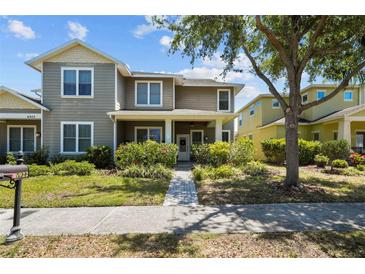 Charming two-story home with welcoming curb appeal and beautifully landscaped front yard at 6922 Duffy Ln, Tampa, FL 33616
