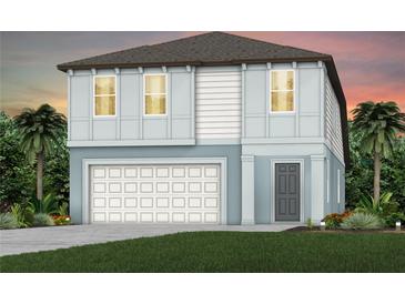Charming two-story home with a two-car garage, lush green lawn, and tropical landscaping at 9967 Trellis Vine Way, Parrish, FL 34219