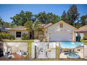 Charming single-story home with a well-manicured lawn, mature trees, and a two-car garage at 1916 Sandstone Pl, Clearwater, FL 33760