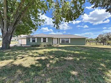 Charming single-story home boasts a well-maintained lawn and a convenient carport at 3908 N Forbes Rd, Plant City, FL 33565