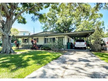 Charming single story home with covered carport and mature landscaping at 6350 55Th N Ave, St Petersburg, FL 33709