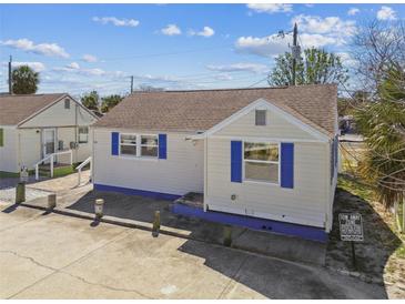 Charming home showcasing a classic design and blue accents, in a sunny neighborhood setting at 101 146Th Ave, Madeira Beach, FL 33708