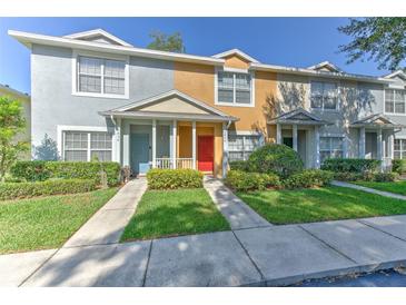 Charming townhomes featuring colorful exteriors and well-maintained landscaping at 3456 High Hampton Cir, Tampa, FL 33610