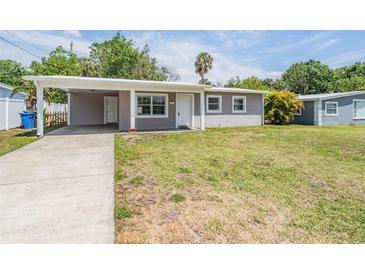 Charming single-story home featuring a covered carport and a well-maintained front yard at 5111 Eldorado Dr, Tampa, FL 33615