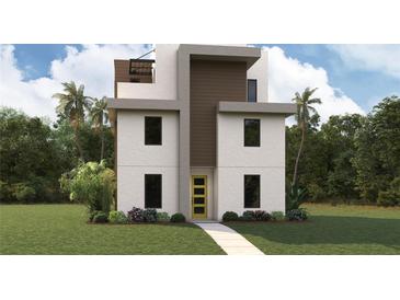 Modern three-story home featuring a bright yellow front door, clean lines and neutral colors, surrounded by lush landscaping at 801 N Oregon Ave, Tampa, FL 33606