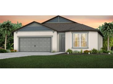 Charming one-story home featuring a two-car garage, manicured lawn and tropical landscaping at 9954 Trellis Vine Way, Parrish, FL 34219