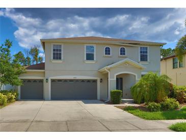 Charming home with a three-car garage and well-maintained landscaping at 2463 Carnation Ct, North Port, FL 34289