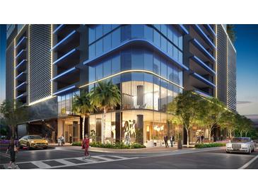 Stunning exterior view of a modern building with sleek architecture and vibrant surroundings, palm trees, and luxury cars at 1101 E Jackson St # 2519, Tampa, FL 33602