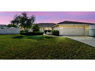Well-maintained lawn, manicured shrubs, and a charming one-story home create a welcoming curb appeal at 14078 Leeward Dr, Seminole, FL 33776