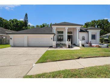 Charming single-story home featuring a 3-car garage and well-maintained landscaping at 8406 Glengarry Pl, Trinity, FL 34655
