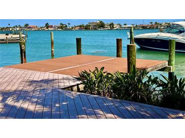 Waterfront property featuring a wooden dock and boat access with beautiful views at 530 59Th Ave, St Pete Beach, FL 33706