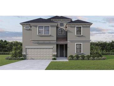 Stunning two-story home with a neutral color scheme, manicured lawn, and attached garage at 720 W Peninsular St, Tampa, FL 33603