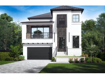Modern two-story home showcasing clean lines, a balcony, black framed windows, and a well-manicured lawn at 519 W Davis Blvd, Tampa, FL 33606