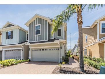 Charming two-story home featuring a brick driveway, attached garage, and pleasant landscaping at 5743 Skytop Dr, Lithia, FL 33547