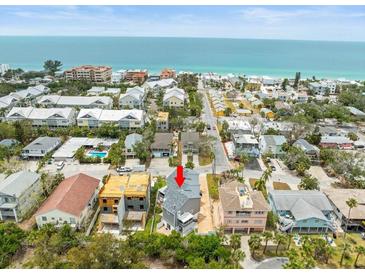 Stunning aerial view of beach homes with easy access to the beautiful ocean, creating a serene coastal living experience at 619 2Nd St # 3, Indian Rocks Beach, FL 33785