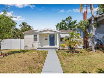 Charming single story home featuring well-maintained landscaping, a walkway, and neutral paint at 3300 Jackson N St, St Petersburg, FL 33704