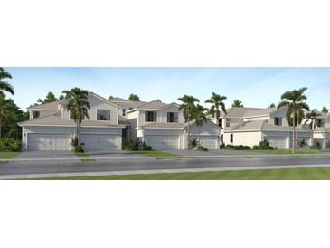 Charming two-story townhomes featuring two-car garages and landscaping create a welcoming community atmosphere at 5628 Summit Pointe Cir # 101, Bradenton, FL 34210