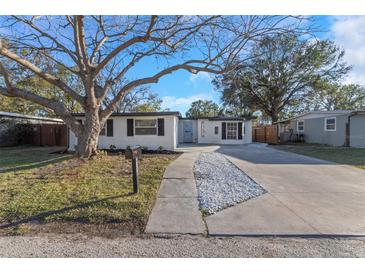 Charming single-story home with a well-maintained lawn and a concrete driveway at 6136 56Th N Ave, St Petersburg, FL 33709