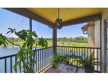 Relaxing screened-in balcony with gorgeous views of the lake and golf course at 2400 Feather Sound Dr # 735, Clearwater, FL 33762