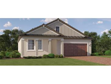 Charming one-story home with a brick driveway, neutral siding, well-manicured lawn and a two-car garage at 31793 Griffin Sands Ln, San Antonio, FL 33576