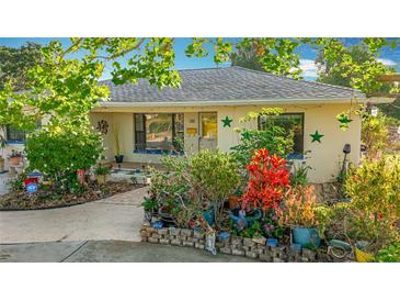 Charming single-story home with a beautiful front yard and well-maintained landscaping at 5100 Aragon S Way, St Petersburg, FL 33705