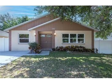 Charming single-Gathering home featuring a well-maintained lawn and inviting double-door entrance at 6328 S Harold Ave, Tampa, FL 33616