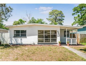 Charming single-story home with a cozy front porch and well-lit windows at 3251 34Th N Ave, St Petersburg, FL 33713