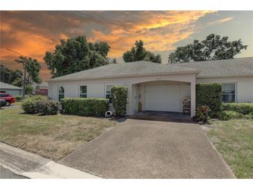Charming single-story home with a well-maintained lawn, driveway, and attached one car garage at 8358 Candlewood Rd, Seminole, FL 33777
