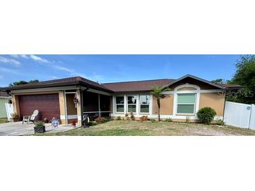 Charming single-story home with well-maintained landscaping and inviting curb appeal at 150 Tompkins St, Port Charlotte, FL 33954
