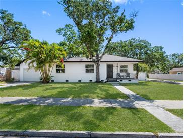 Charming single-story home features a well-maintained lawn, mature trees and a welcoming front porch at 2322 21St S St, St Petersburg, FL 33712
