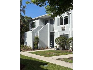 Charming condo featuring neutral paint, well-maintained landscaping, and an inviting entrance at 4127 Dolphin Dr # 4127, Tampa, FL 33617