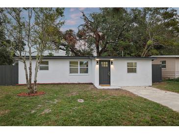 Charming single-story home featuring a freshly painted exterior, updated windows, and a well-manicured front yard at 11747 104Th N St, Largo, FL 33773