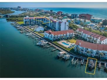 Gorgeous aerial view showcases complex, pool, boat slips, and stunning Gulf of Mexico and coastal waterway access at 19111 Vista Bay Dr # 603, Indian Shores, FL 33785